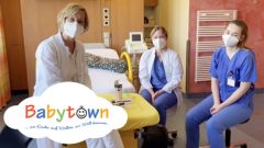 Bild Ärzte und Hebammen im Kreißsaal